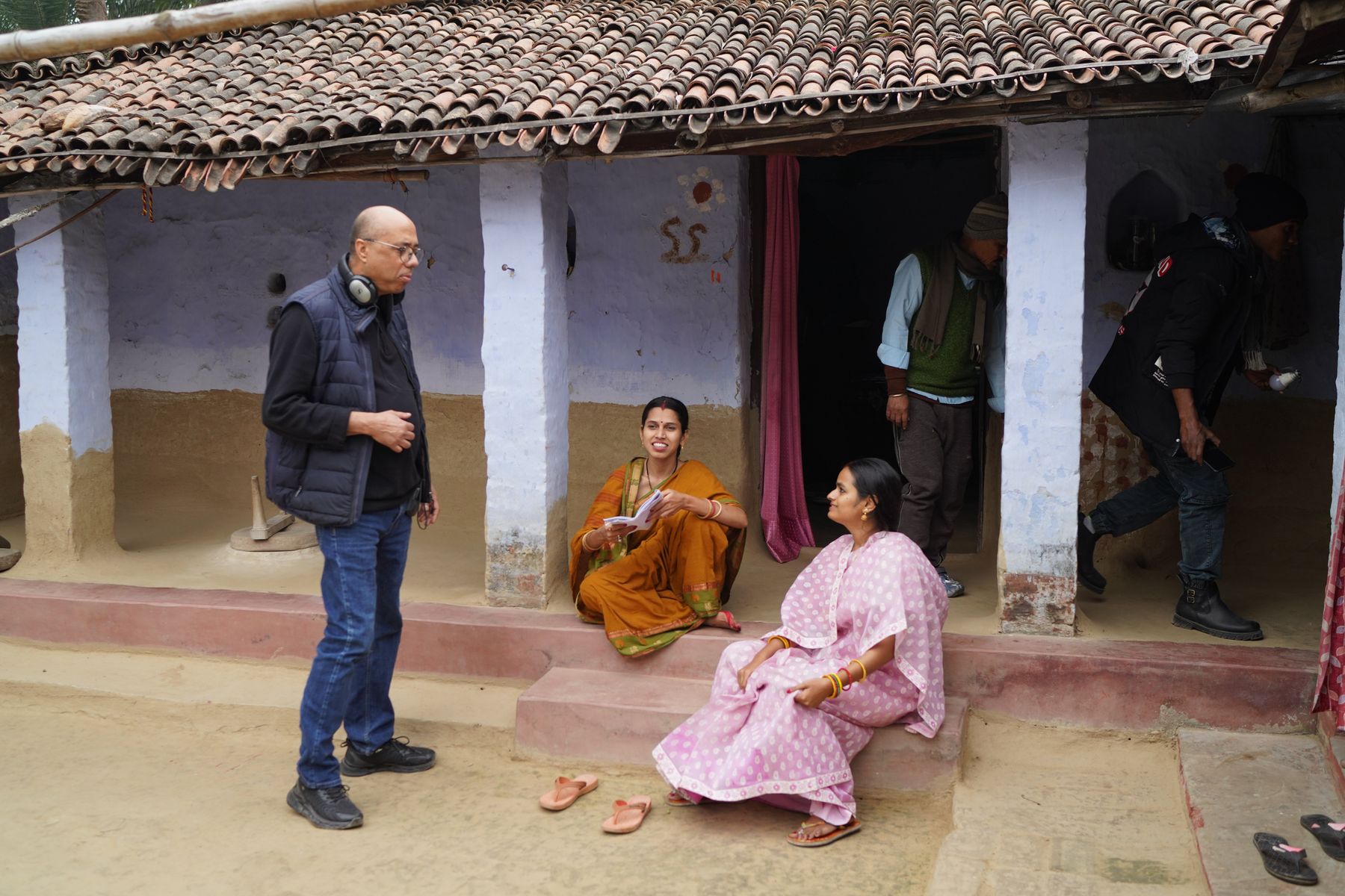 Director Sanjay Jha with cast on the village set