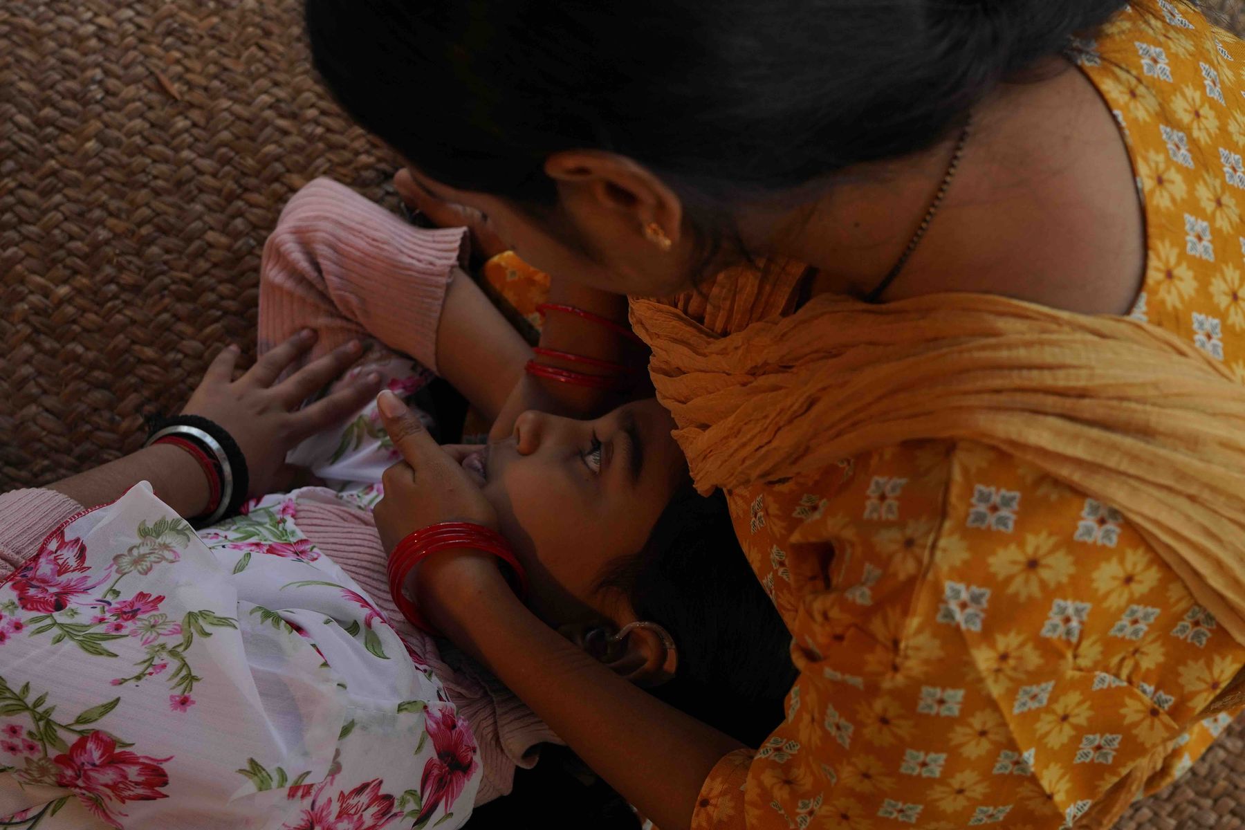 A quiet between-takes moment with mother and daughter