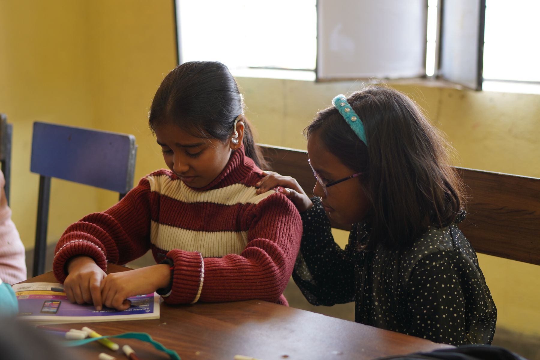 Chutki in classroom with a friend